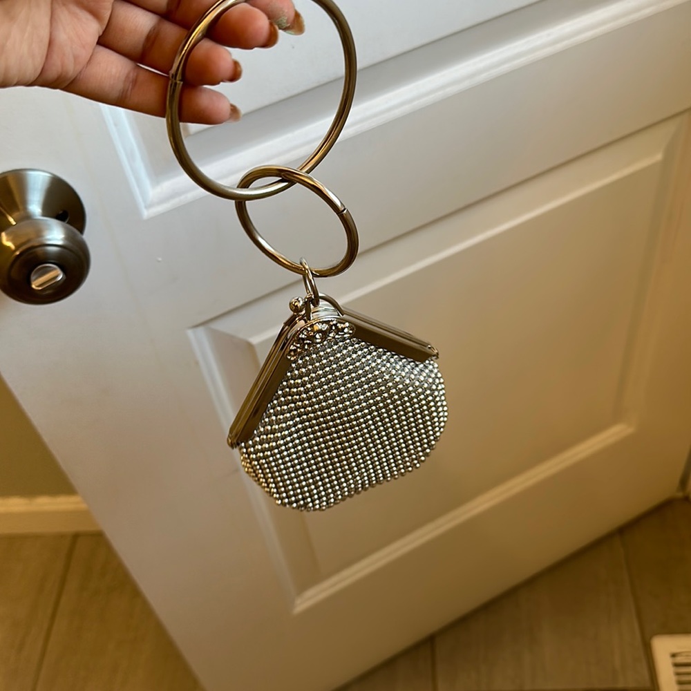 Silver beautiful clutch available in Brand new condition